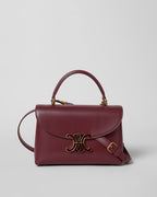 TEEN NINO BAG IN SMOOTH SATINATED CALFSKIN WITH ENAMEL CLOSURE