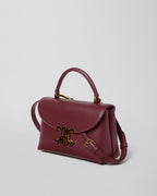 TEEN NINO BAG IN SMOOTH SATINATED CALFSKIN WITH ENAMEL CLOSURE