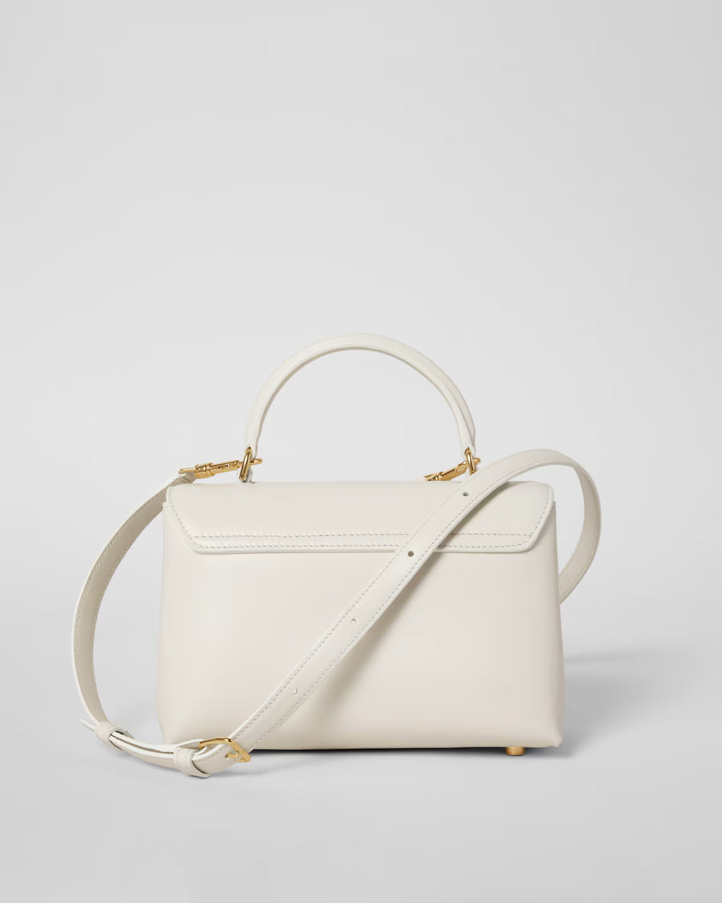 TEEN NINO BAG IN SMOOTH SATINATED CALFSKIN WITH ENAMEL CLOSURE