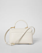 TEEN NINO BAG IN SMOOTH SATINATED CALFSKIN WITH ENAMEL CLOSURE