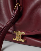 Soft Triomphe Halfmoon IN SHINY LAMBSKIN