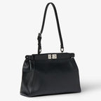 Black leather bag embroidered with mirrors