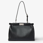 Black leather bag embroidered with mirrors