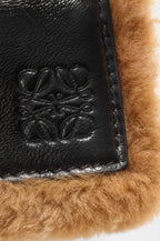 Small Puzzle Aviator bag in glossy lambskin and shearling