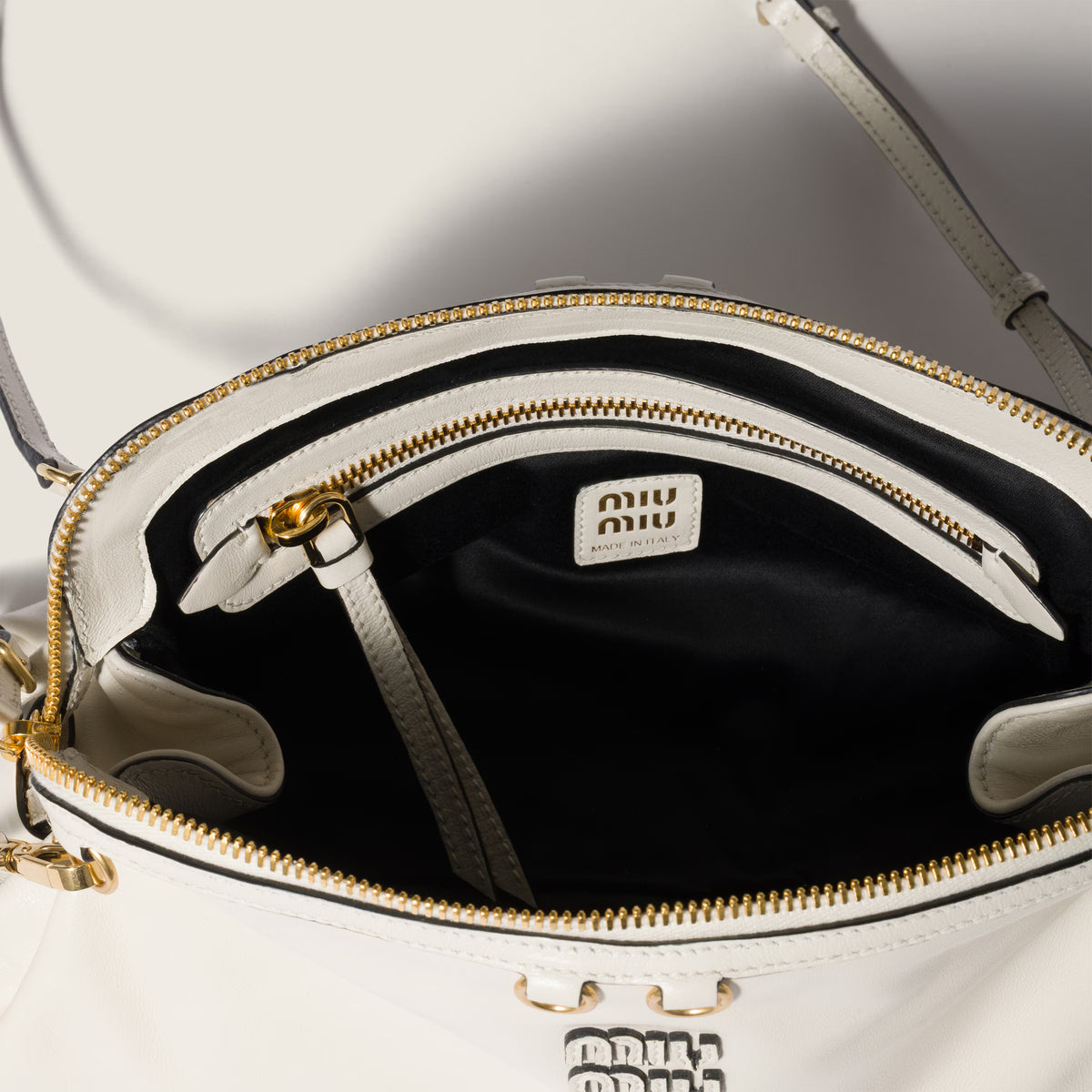 Caprice shiny leather clutch