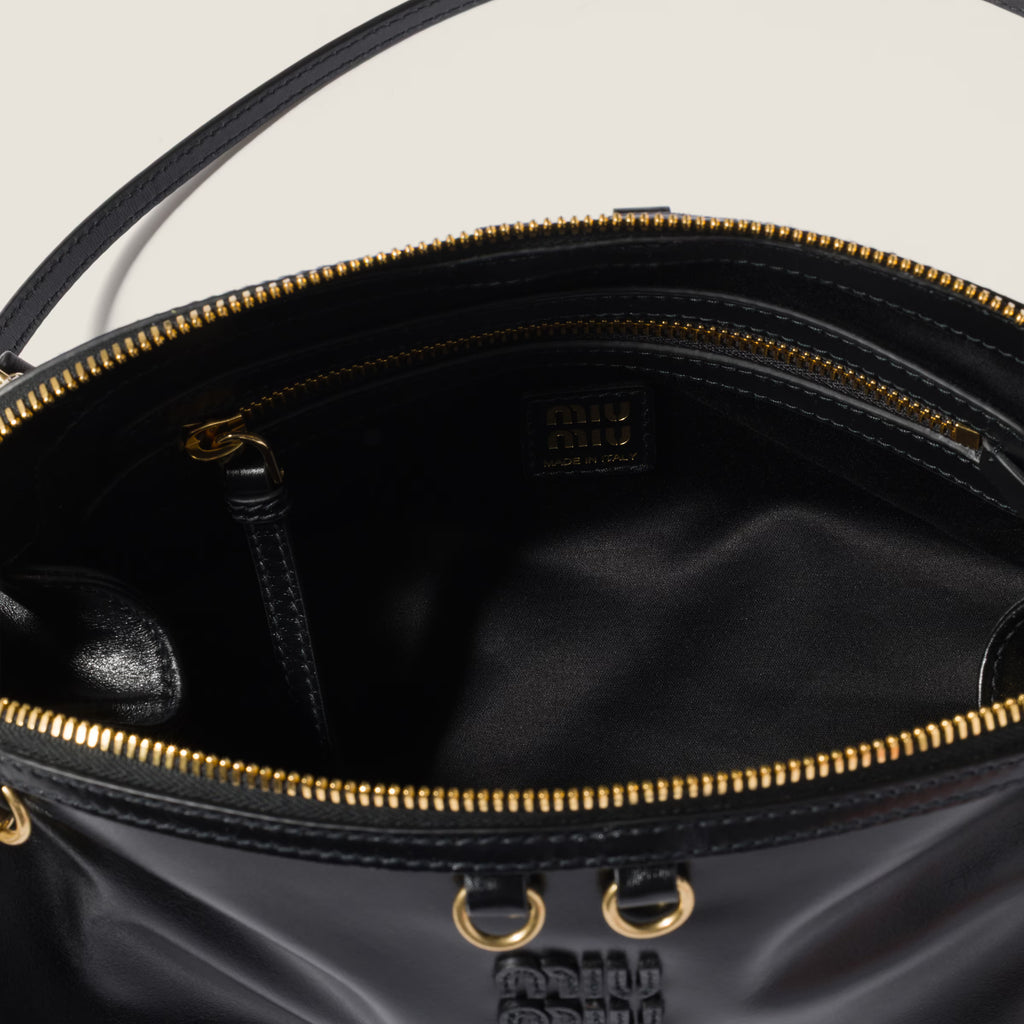 Caprice shiny leather clutch