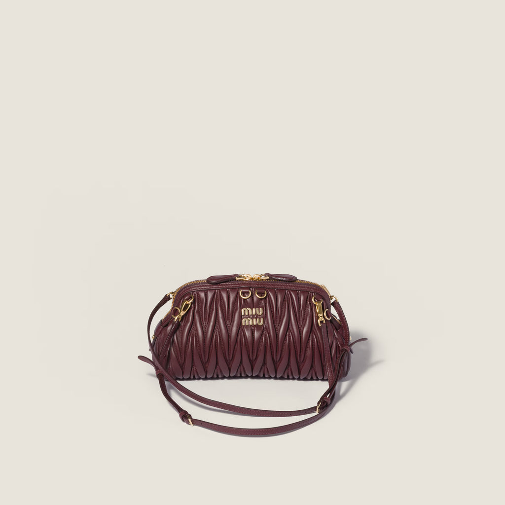 Caprice matelassé nappa leather clutch