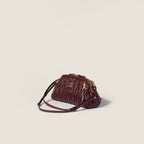 Caprice matelassé nappa leather clutch