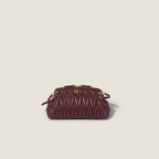 Caprice matelassé nappa leather clutch