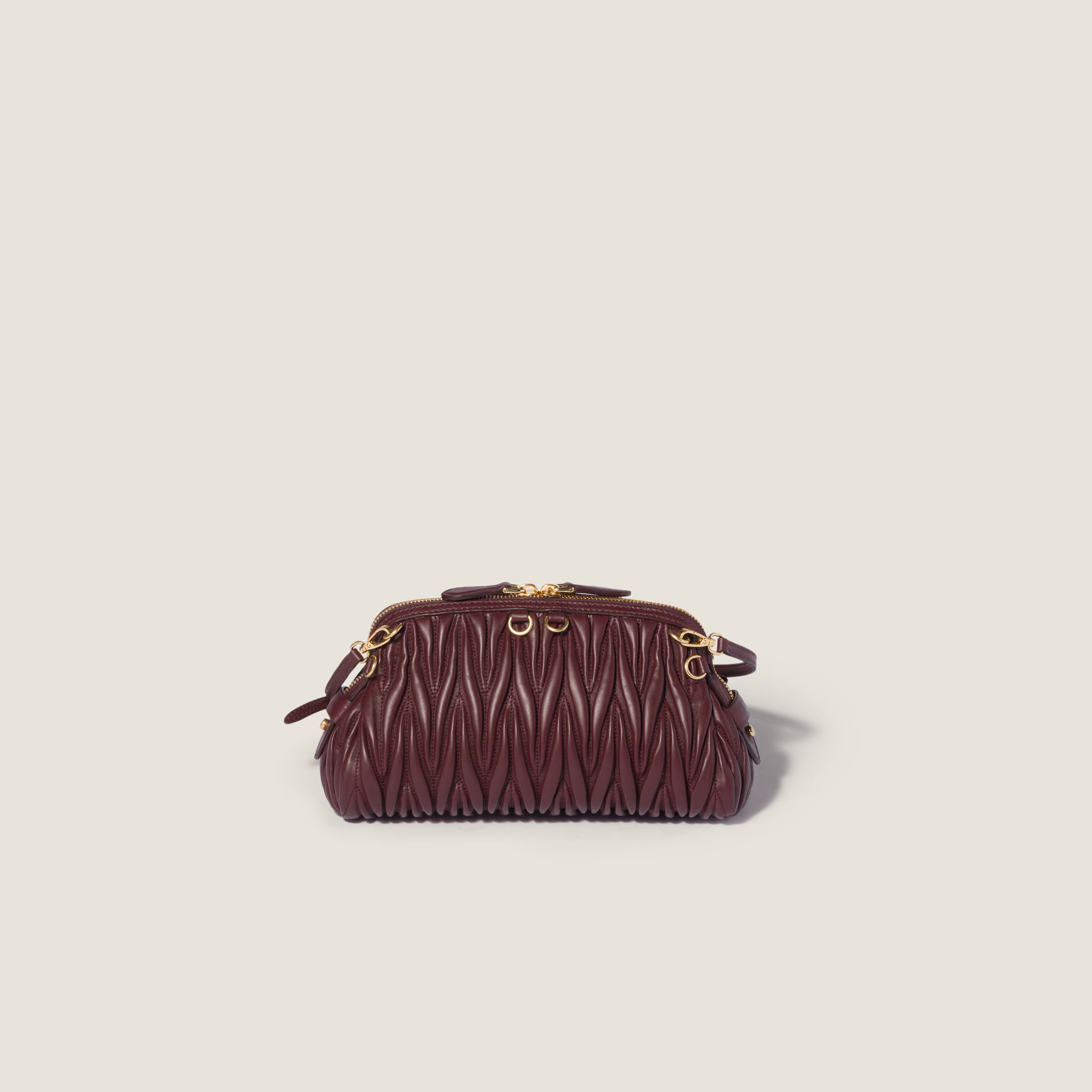 Caprice matelassé nappa leather clutch