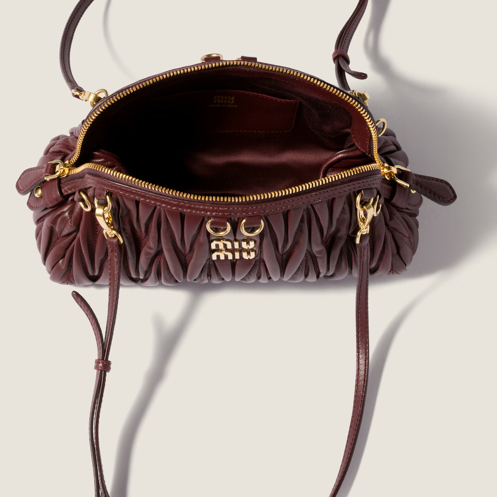 Caprice matelassé nappa leather clutch