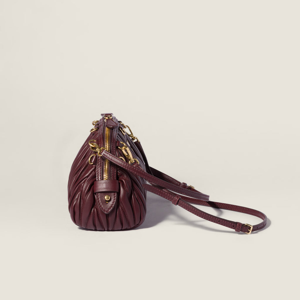 Caprice matelassé nappa leather clutch