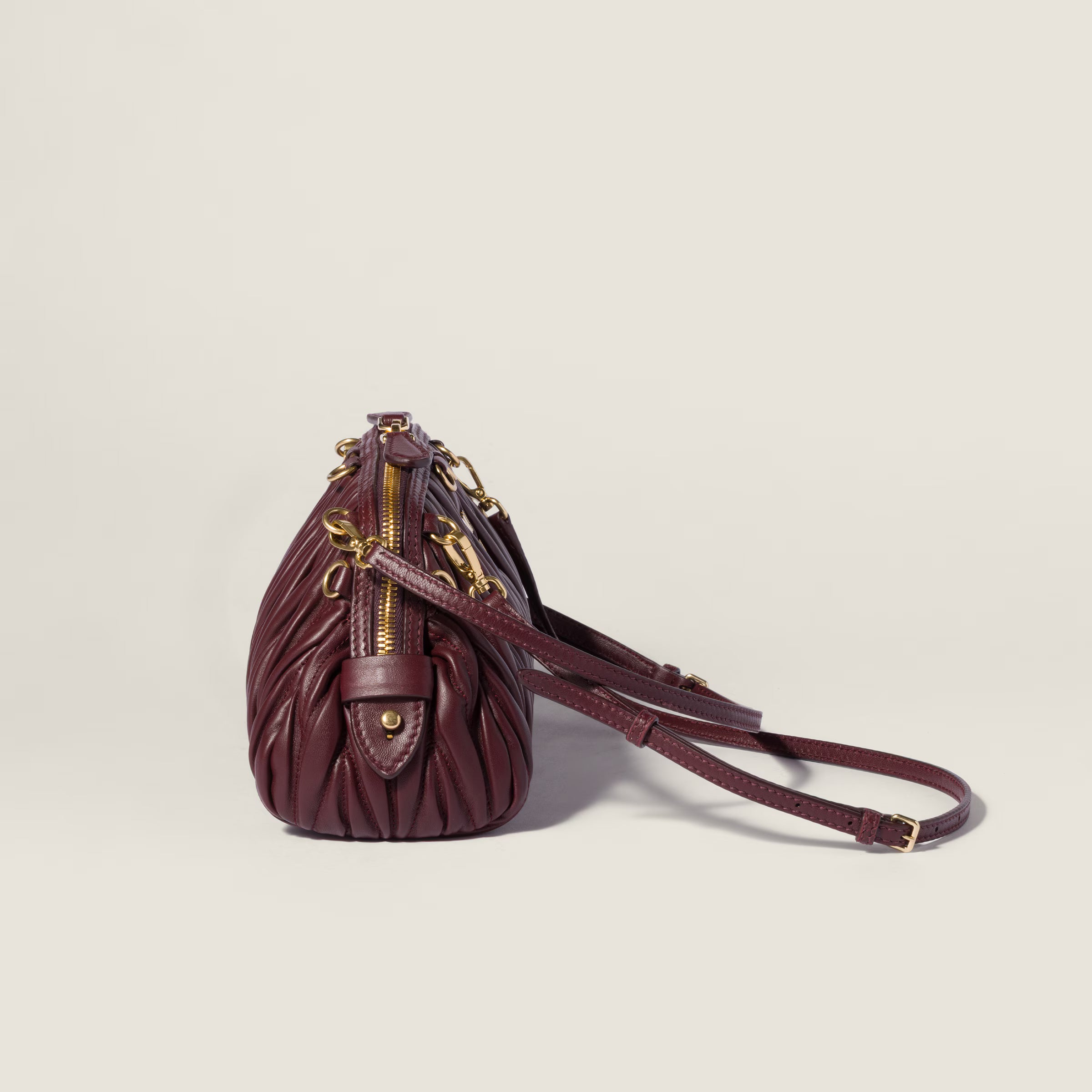 Caprice matelassé nappa leather clutch
