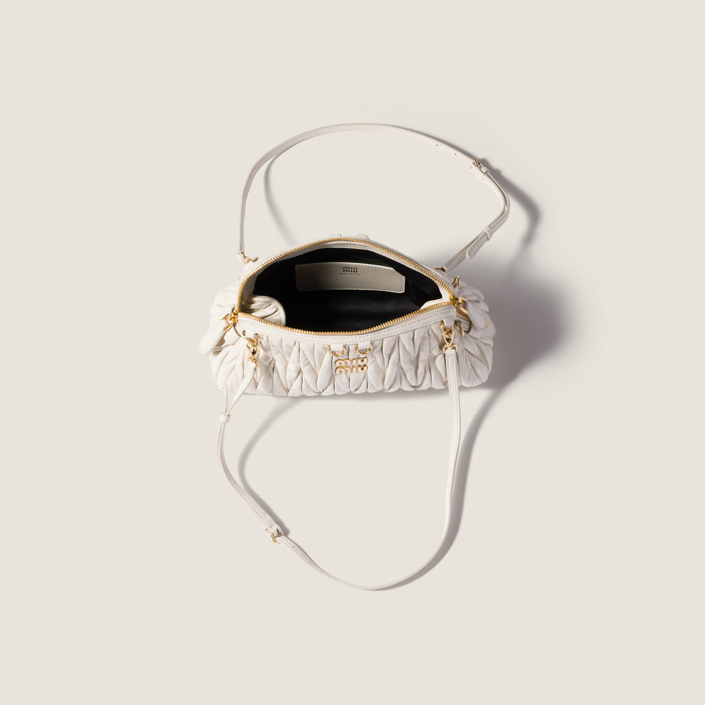 Caprice matelassé nappa leather clutch