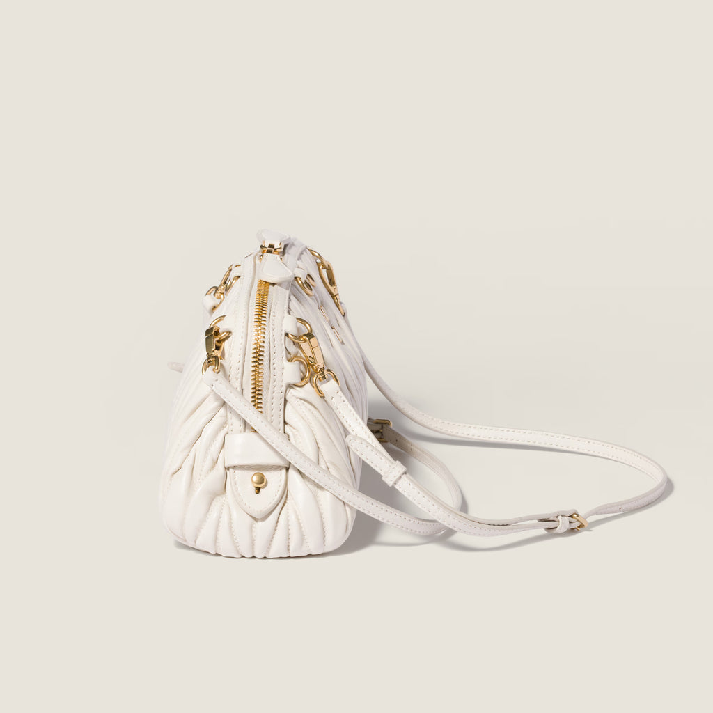 Caprice matelassé nappa leather clutch
