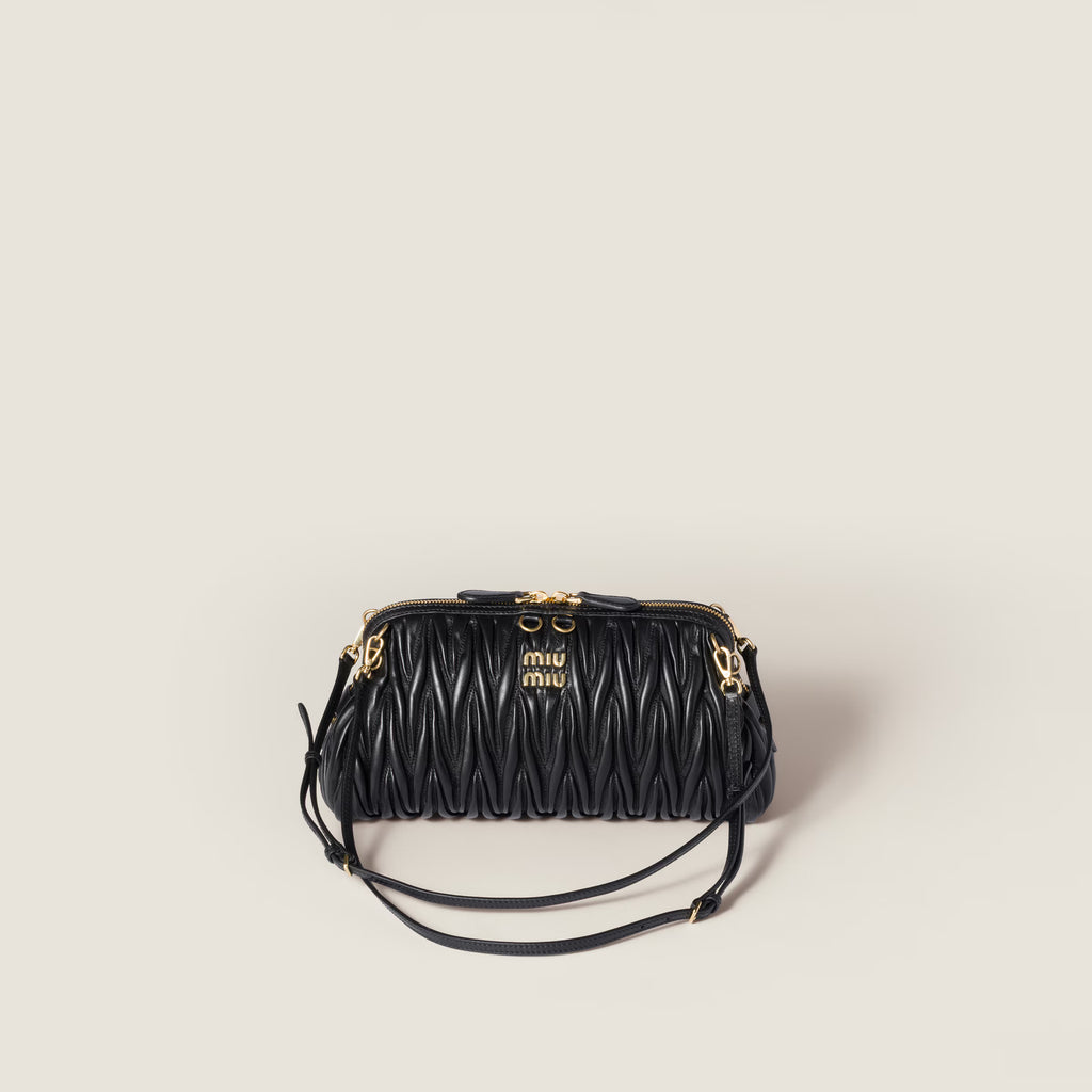 Caprice matelassé nappa leather clutch