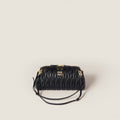 Caprice matelassé nappa leather clutch