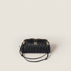 Caprice matelassé nappa leather clutch