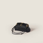 Caprice matelassé nappa leather clutch